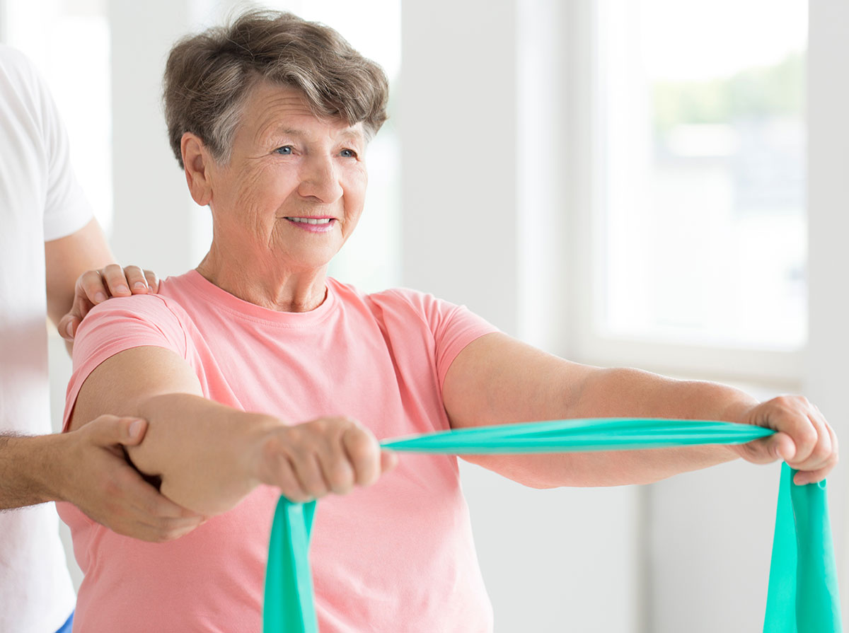 Elderly-Woman-Working-Out-With-Resitance-Band.jpg