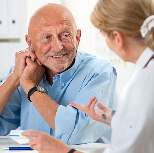 Elderly-Man-Talking-With-Doctor.jpg