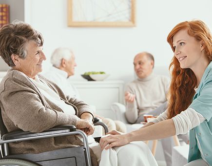 Elderly-Woman-And-Nurse-Talking.jpg