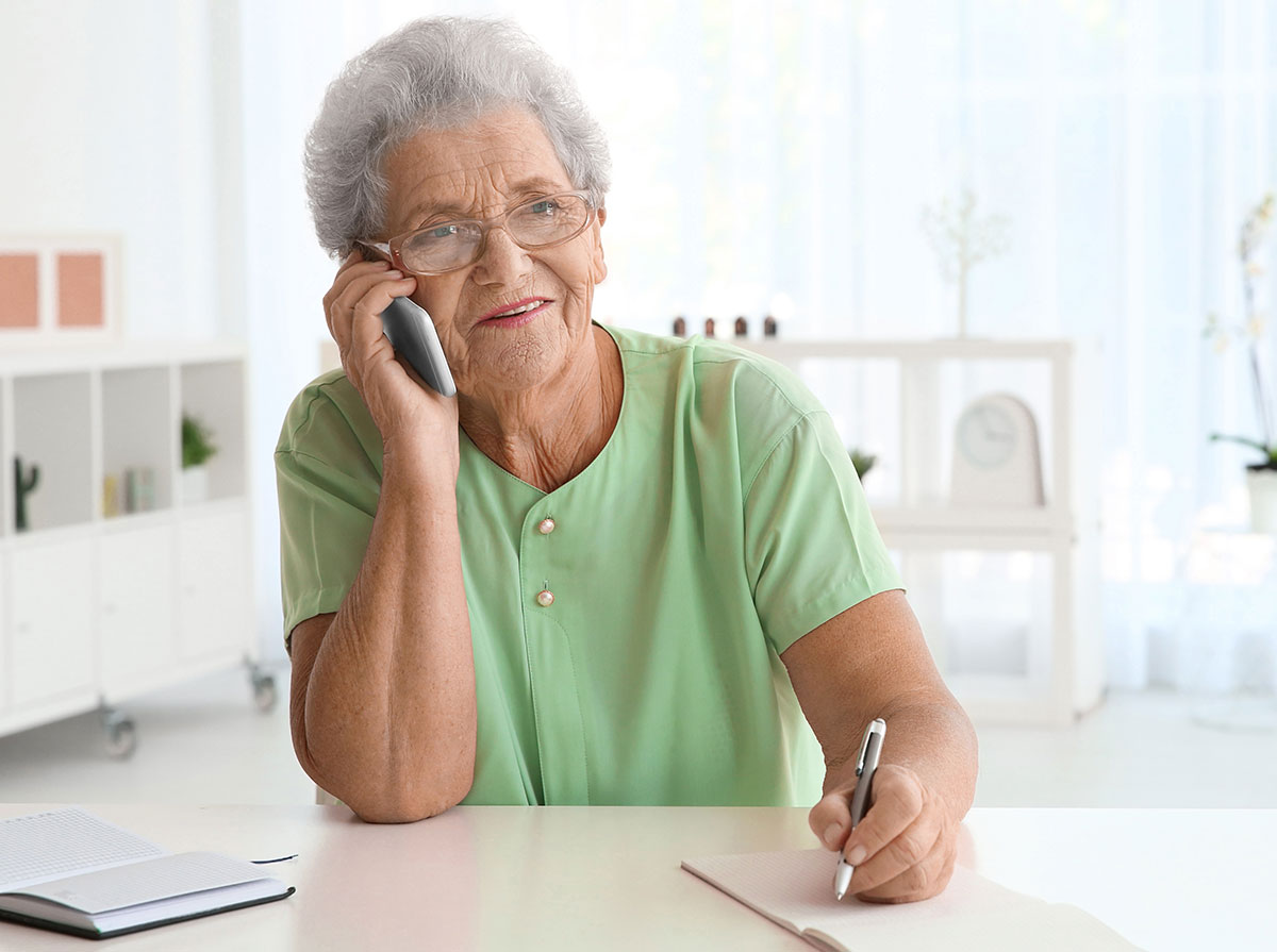 Elderly-Woman-Talking-On-Phone.jpg